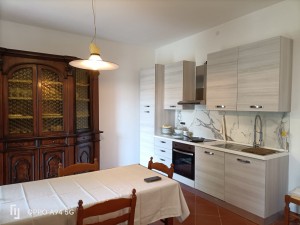 soggiorno con angolo cottura
